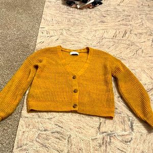 Yellow V-neck sweater with buttons